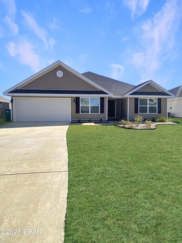 ranch-style home featuring a garage and a front yard