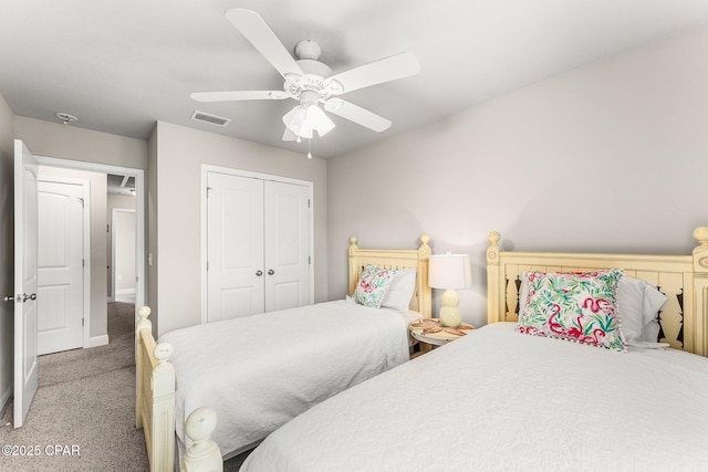 bedroom with light carpet, a closet, and ceiling fan