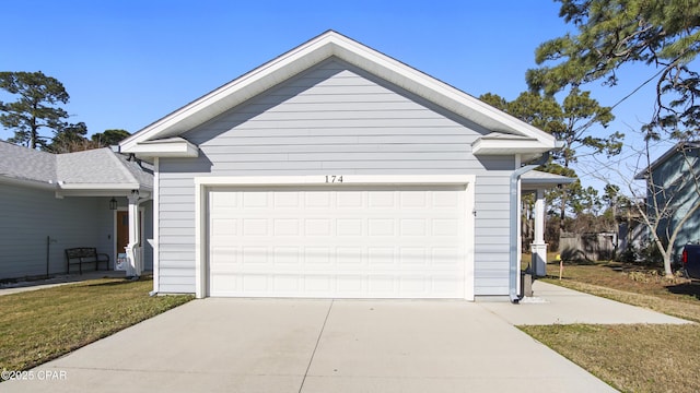 garage featuring a yard