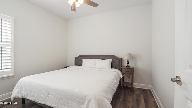 bedroom with dark wood-type flooring and ceiling fan