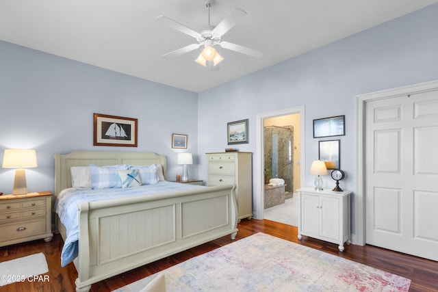 bedroom featuring ceiling fan, ensuite bath, and wood finished floors