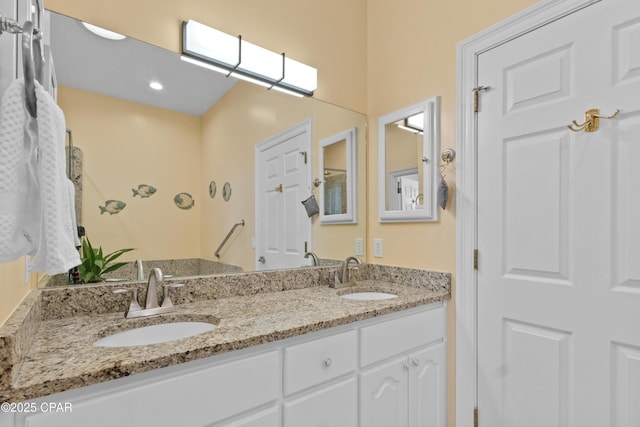 bathroom featuring double vanity and a sink