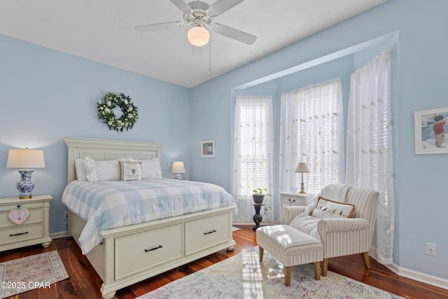 bedroom featuring dark wood-style floors, ceiling fan, and baseboards