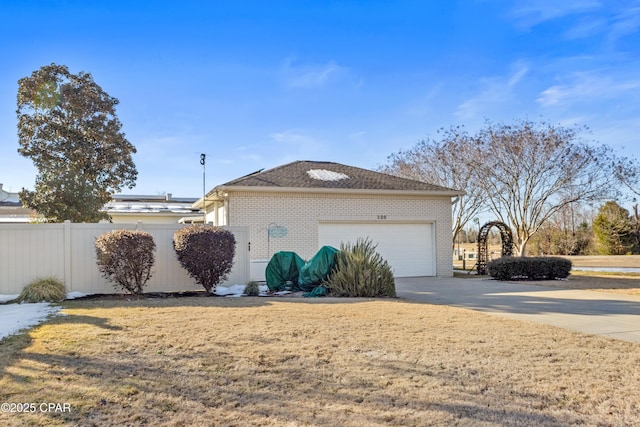 view of front of property with a garage, brick siding, fence, and driveway