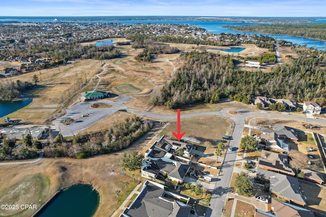 birds eye view of property featuring a water view and a residential view