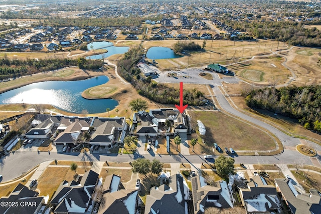 bird's eye view featuring a residential view and a water view