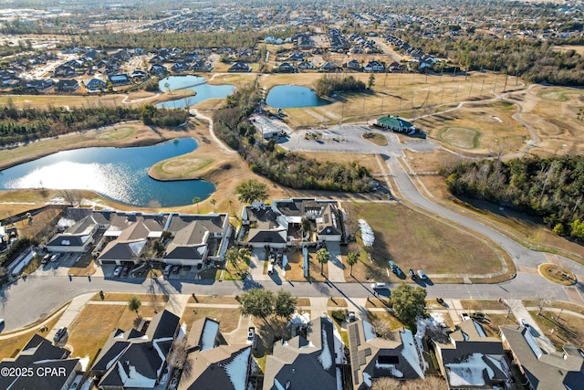 birds eye view of property with a residential view and a water view