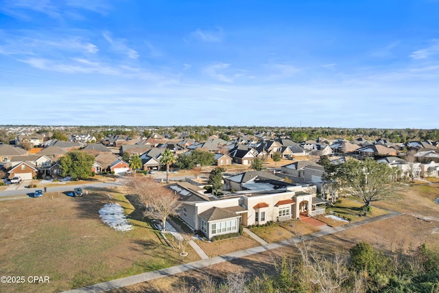 birds eye view of property with a residential view