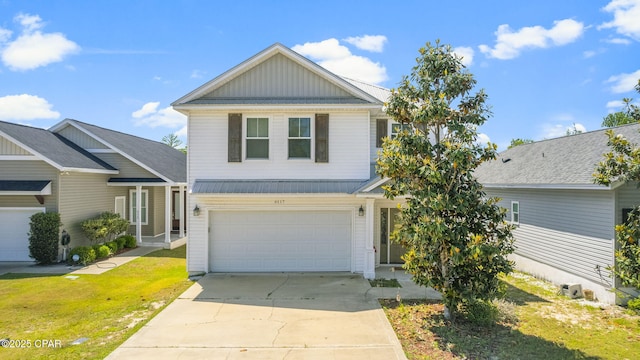 view of front property featuring a garage and a front yard