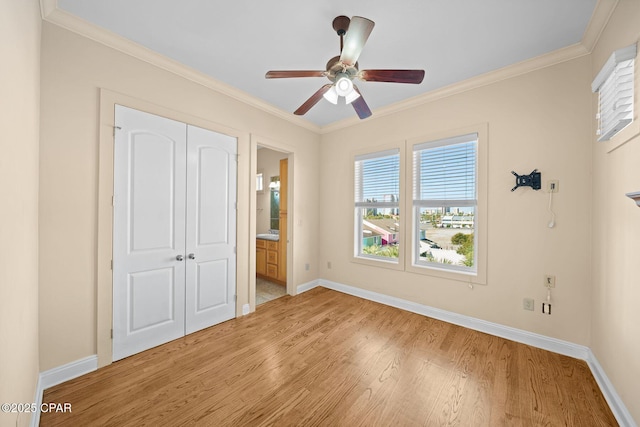 unfurnished bedroom with ceiling fan, crown molding, ensuite bath, and light hardwood / wood-style flooring