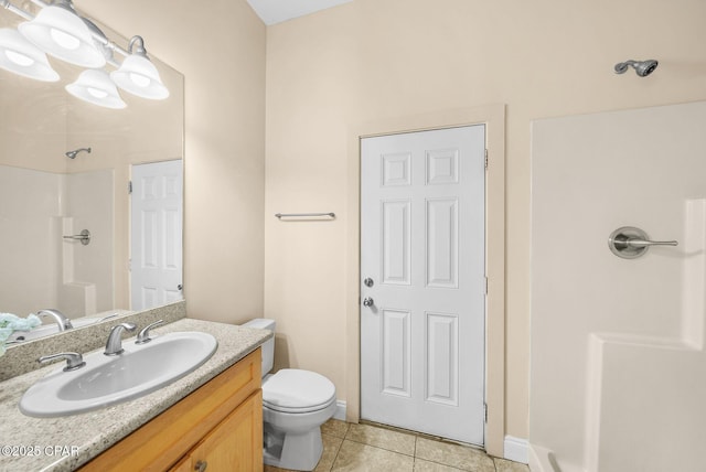 bathroom with walk in shower, vanity, toilet, and tile patterned flooring