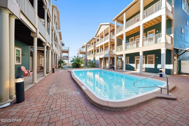 view of swimming pool featuring a patio area