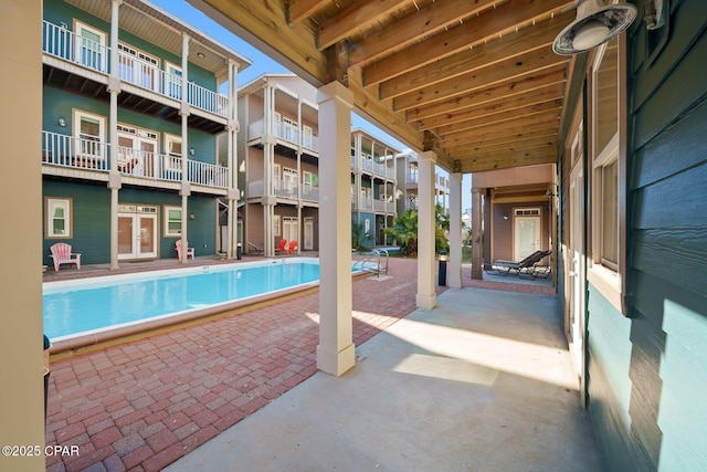 view of swimming pool with a patio