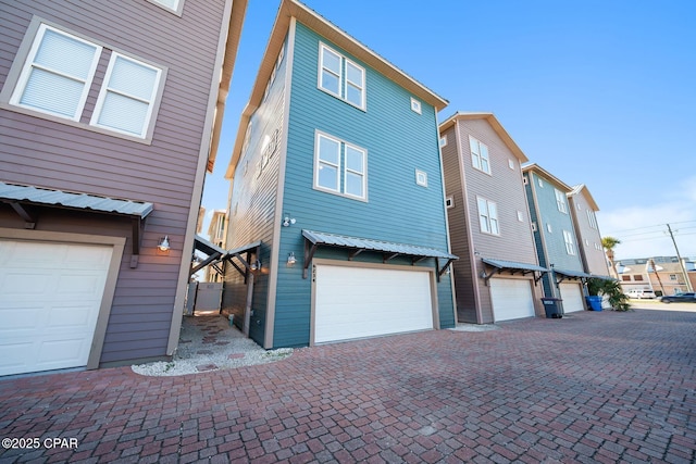 view of side of home with a garage