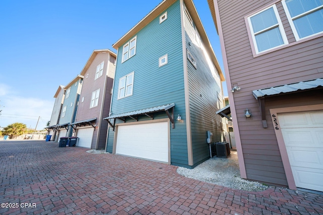 view of side of property with a garage