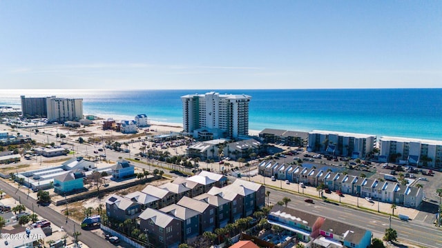 bird's eye view featuring a view of the beach and a water view