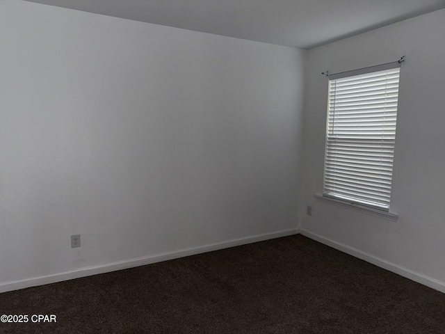 6610 Boat Race Rd, Panama City, FL 32404 - spare room featuring dark colored carpet and baseboards