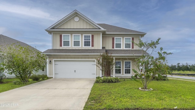 view of front facade featuring a garage and a front lawn