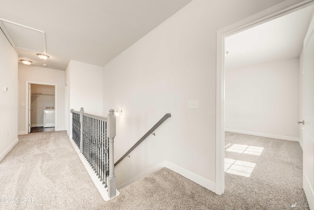 staircase with washer / dryer and carpet