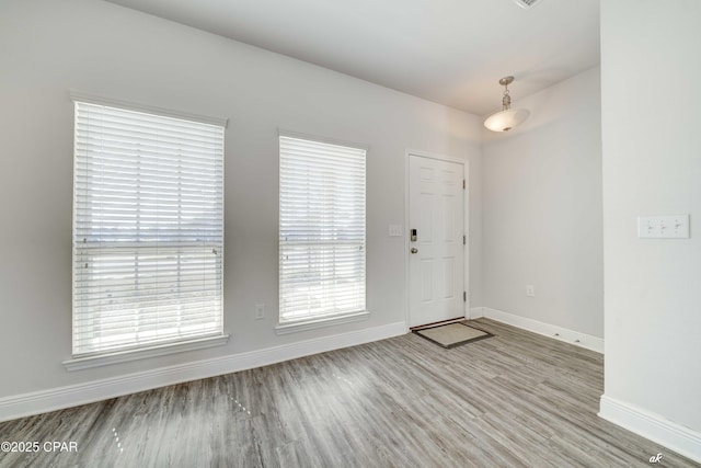 foyer entrance with light wood-type flooring