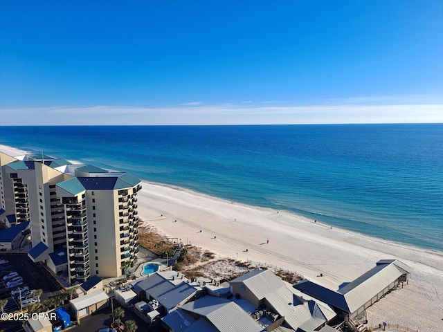 bird's eye view with a water view and a view of the beach