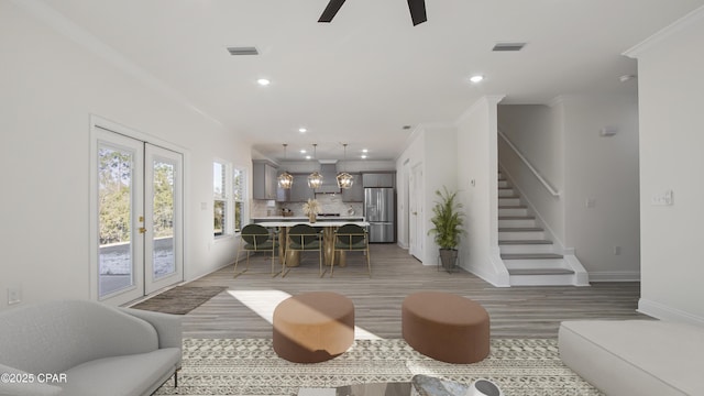 living room with french doors, ceiling fan, ornamental molding, and wood-type flooring