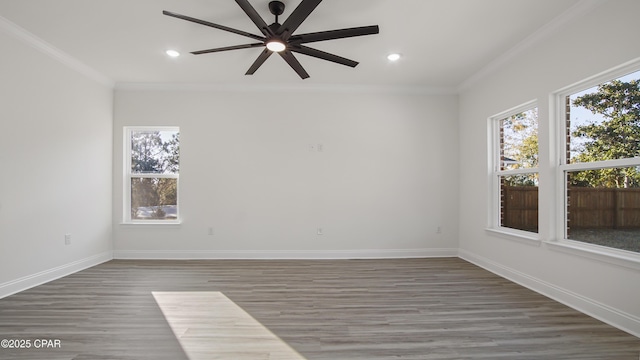 unfurnished room featuring dark hardwood / wood-style flooring, crown molding, and ceiling fan