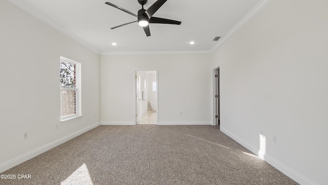 unfurnished bedroom featuring ceiling fan, ornamental molding, light colored carpet, and ensuite bath