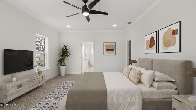 carpeted bedroom with ensuite bathroom, crown molding, and ceiling fan