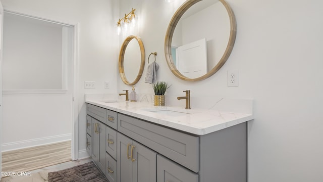 bathroom with tile patterned floors and vanity