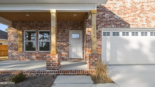 view of exterior entry featuring a garage