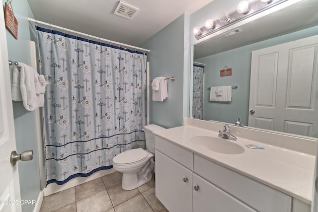 bathroom with vanity, tile patterned floors, toilet, and a shower with shower curtain