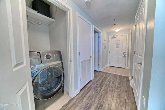 washroom featuring washer / clothes dryer and wood-type flooring