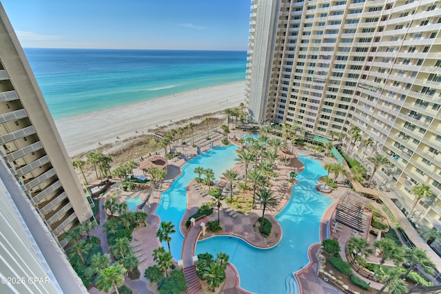 bird's eye view featuring a water view and a view of the beach