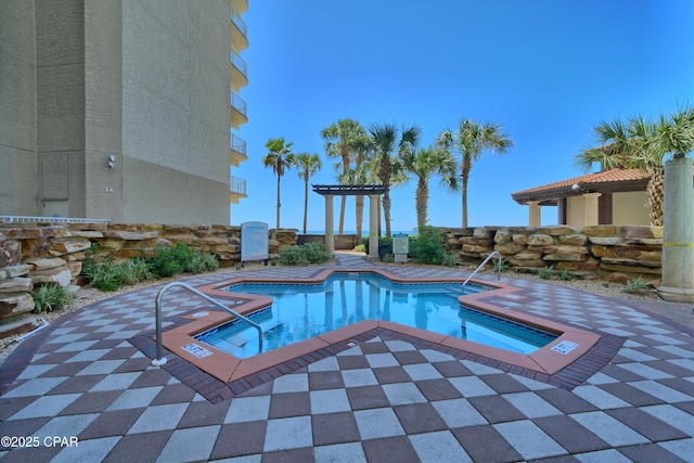 view of swimming pool featuring a patio