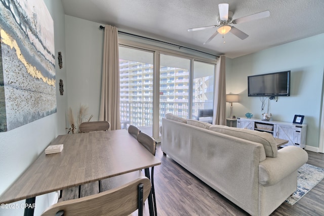 9900 S Thomas Dr Unit 1323, Panama City Beach, FL 32408 - living area with wood finished floors, ceiling fan, and a textured ceiling