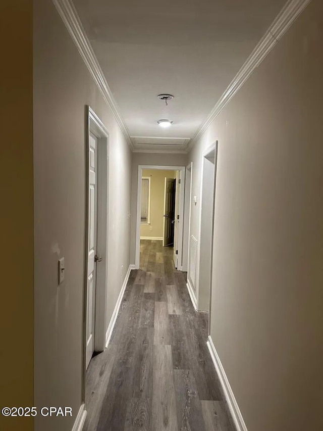 corridor featuring ornamental molding and dark hardwood / wood-style floors