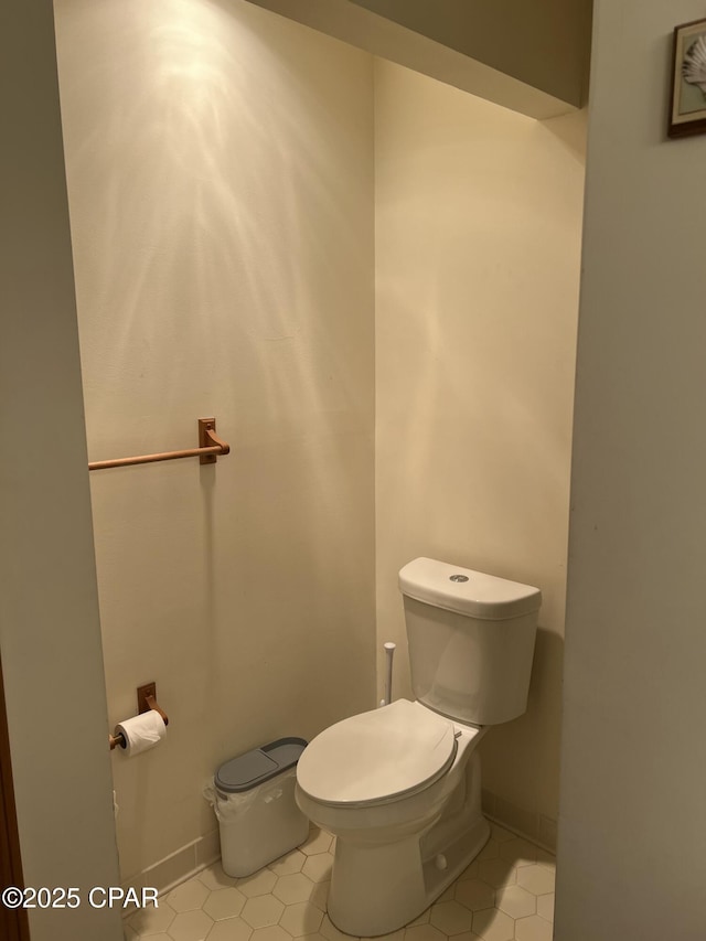 bathroom with tile patterned flooring and toilet