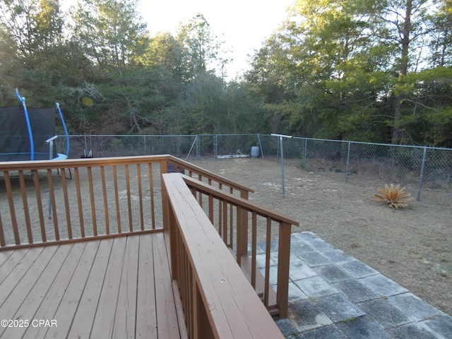 wooden deck with a trampoline