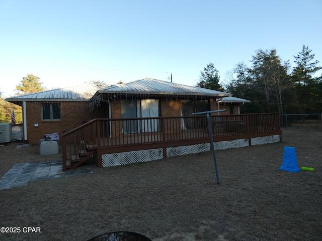 exterior space featuring a deck and central air condition unit