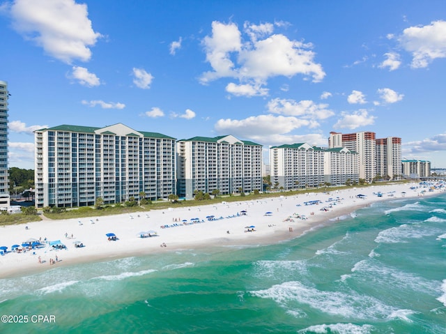 bird's eye view featuring a view of the beach and a water view