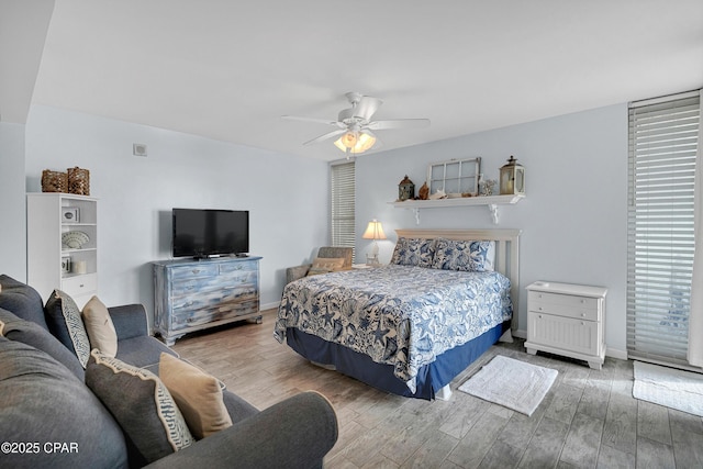 bedroom with hardwood / wood-style flooring and ceiling fan