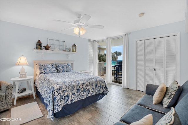 bedroom with light hardwood / wood-style floors, access to outside, ceiling fan, and a closet