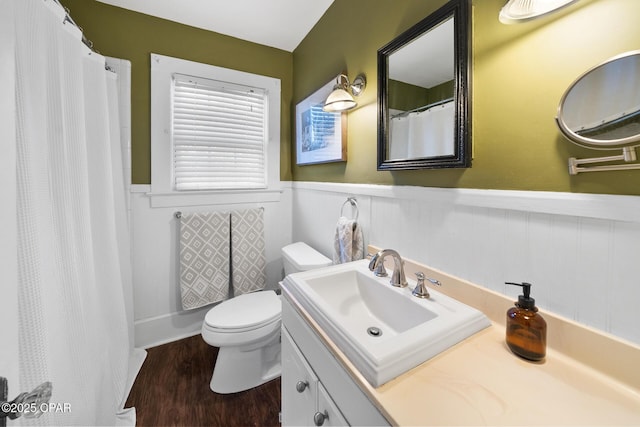 bathroom featuring hardwood / wood-style flooring, vanity, and toilet