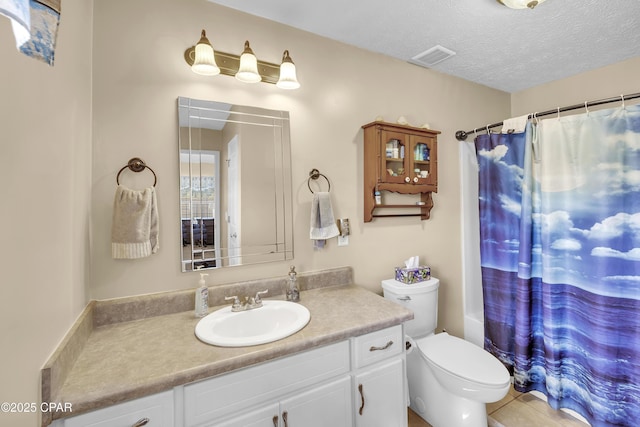 full bathroom featuring shower / bathtub combination with curtain, vanity, a textured ceiling, tile patterned floors, and toilet