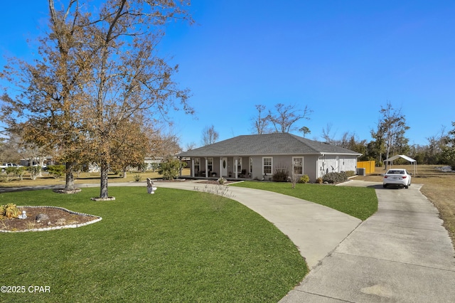 ranch-style house featuring a carport and a front lawn