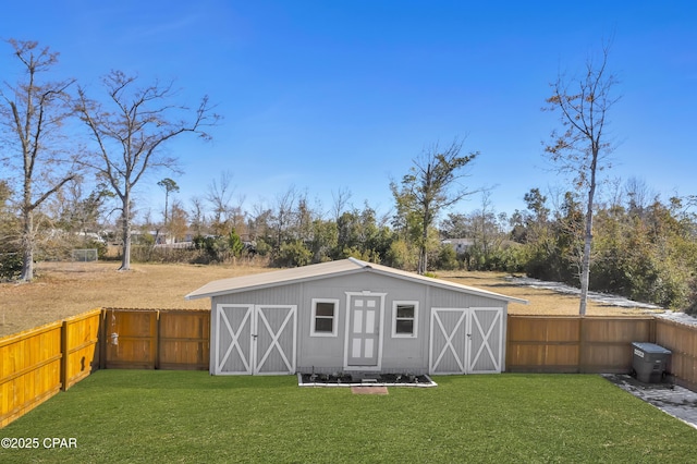 view of outbuilding featuring a lawn