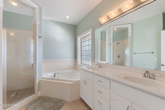 bathroom featuring tile patterned flooring, vanity, and independent shower and bath