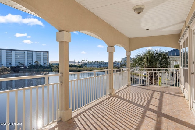 balcony featuring a water view