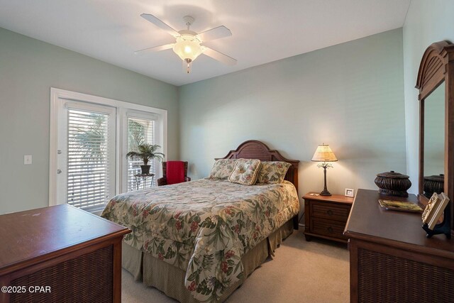 carpeted bedroom with access to outside and ceiling fan